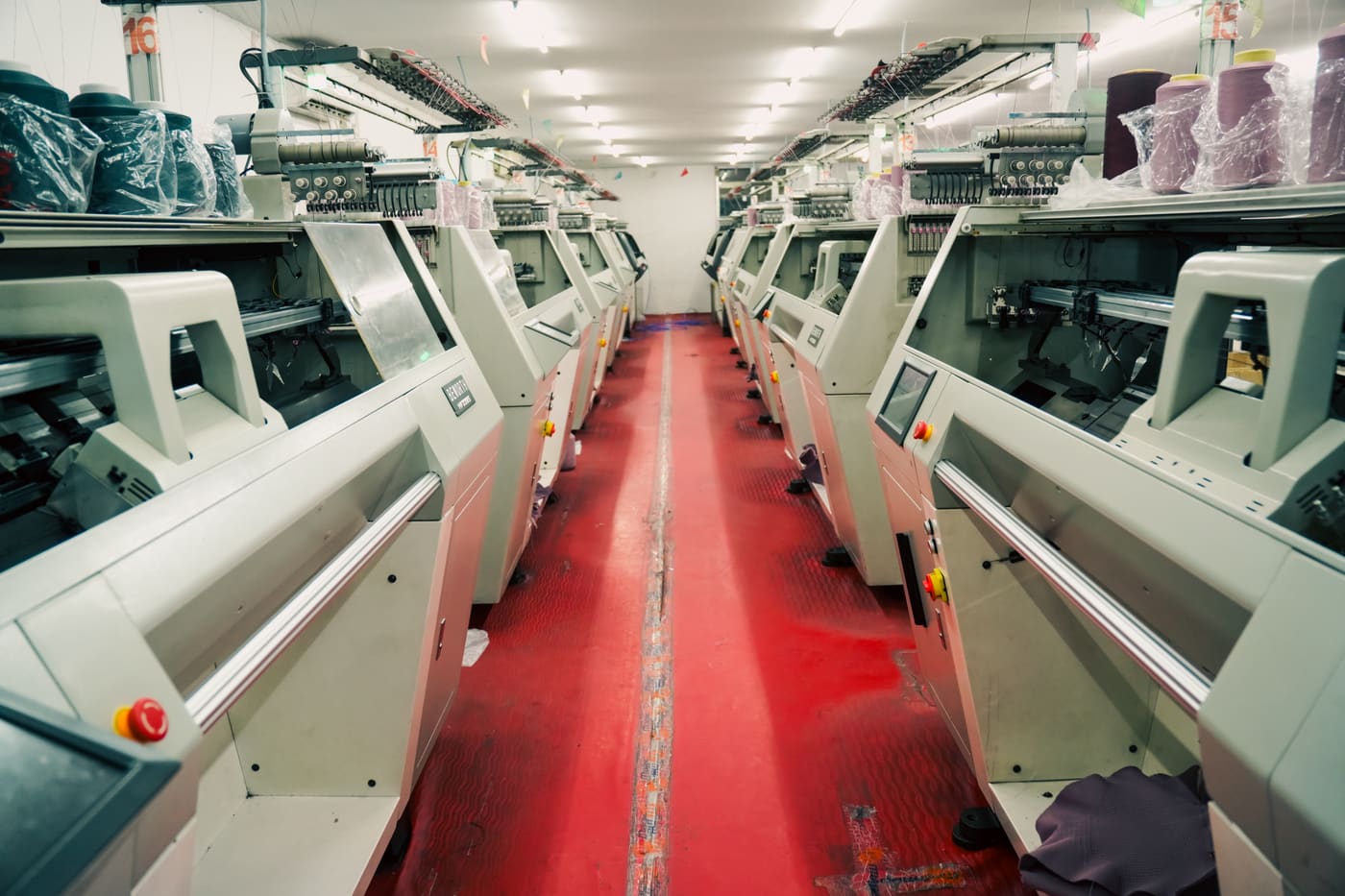Row of embroidery machines in the finishing department