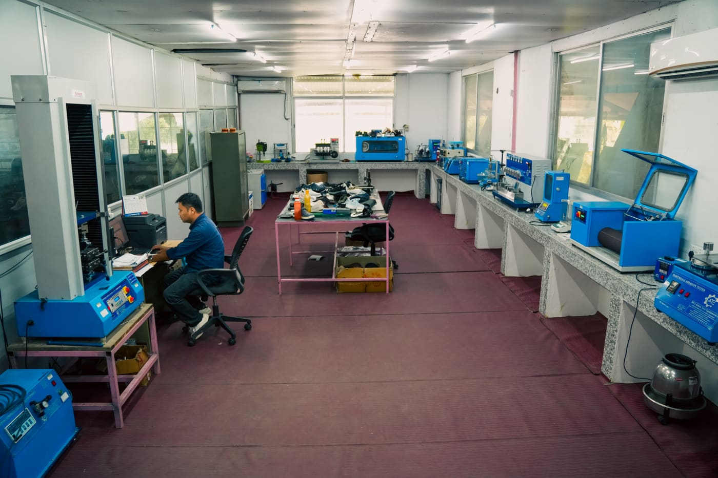 Technician running material tests in the in-house lab